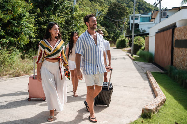 istock Friends arriving at a luxury villa for vacation 1434953722