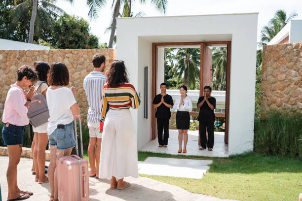 istock Group of tourists greeting their hosts 1434953807