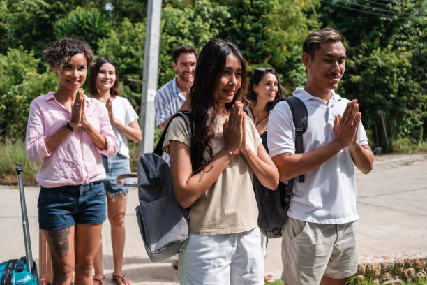 istock Group of tourists greeting their hosts 1434953861
