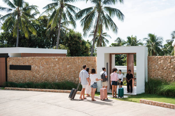 istock Friends arriving at a luxury villa for vacation 1434953995