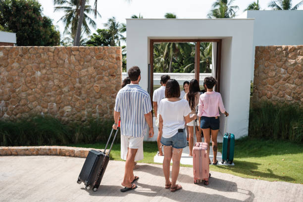 istock Friends arriving at a luxury villa for vacation 1434954399