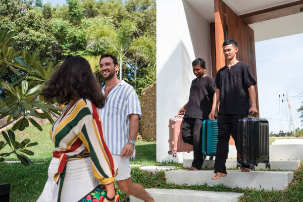istock Bellhops taking guests and their suitcases to the luxury villa 1434954462
