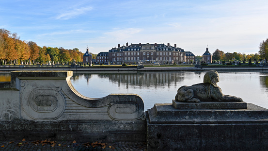 Ludwigslust, Germany - October 3, 2016: The front view of the Ludwigslust palace with garden lake in foreground 