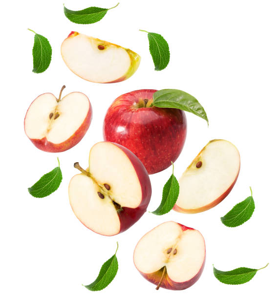 istock flying red apples with green leaf and half isolated on white background. clipping path 1434957423