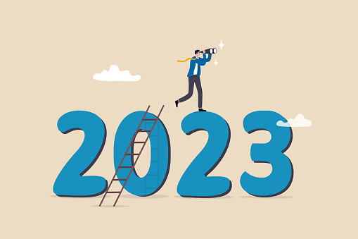 Year 2023 outlook, economic forecast or future vision, business opportunity or challenge ahead, year review or analysis concept, confidence businessman with binoculars climb up ladder on year 2023.