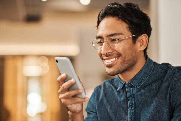 istock Man work from home, smile at smartphone and social media post using 5g internet wifi connection to look at a funny meme. Freelance remote employee, relax on a break and scroll online reading messages 1434960870