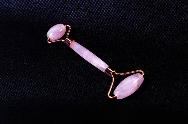 istock rose quartz facial roller and massage stone gua sha isolated on white background, 1434962859