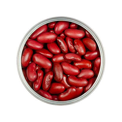 Red kidney beans, in an opened can. Cooked and canned common kidney beans, a variety of the common bean, Phaseolus vulgaris, a vegetarian staple food. Isolated, from above, close-up, macro food photo.