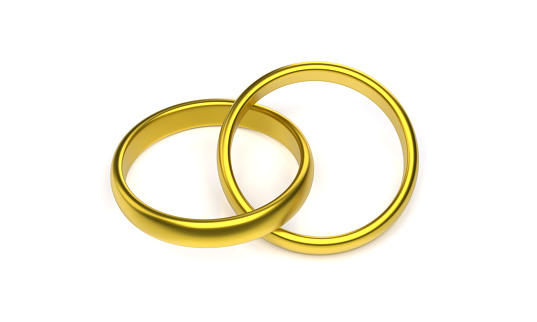 Golden Wedding Rings On White Background