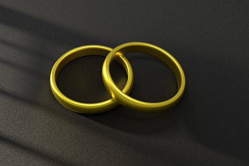 Golden Wedding Rings On Dark Background