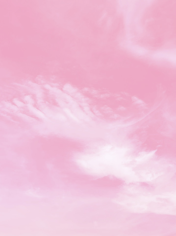 clouds and sky with a pastel pink-colored background