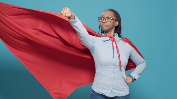 istock Portrait of superhero with flying red cape on camera 1434968738