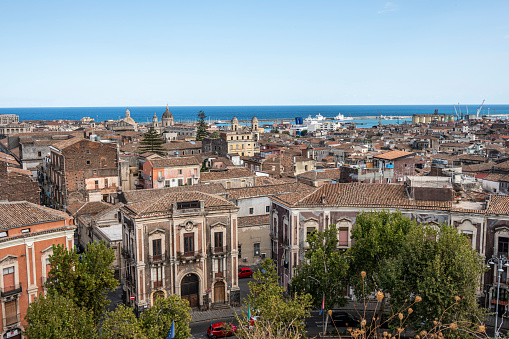 Catania, Italy - 09-23-2022: Aerial panorama of Catania with the port in the background