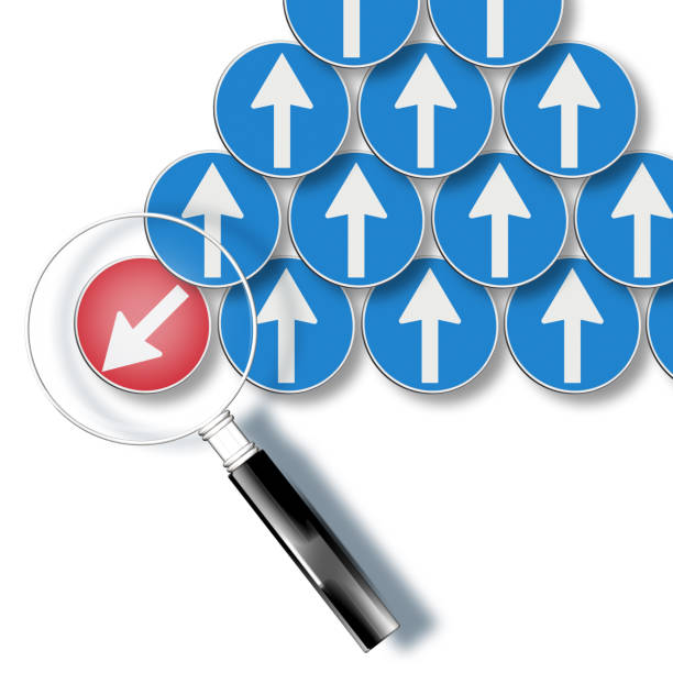 istock Countercurrent metaphor with red arrow goes against - Concept seen through a magnifying glass 1434969071