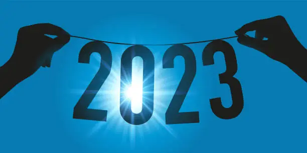 Vector illustration of Greeting card with two hands holding a garland against the light to present the new year 2023.