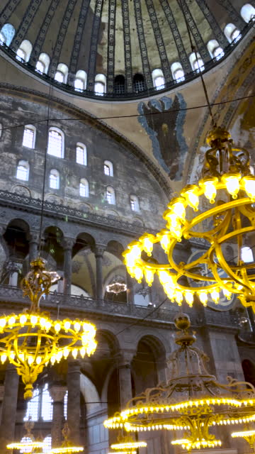 Interior of Hagia Sophia Grand Mosque (Ayasofya-i Kebir Cami-i Şerifi) with beautiful chandeliers, Istanbul Turkey