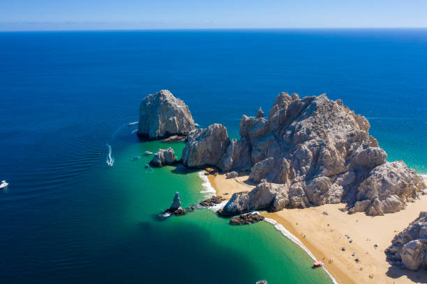 istock Aerial view of the Lovers Beach with a cloudy blue sky in the background, Mexico 1434973473