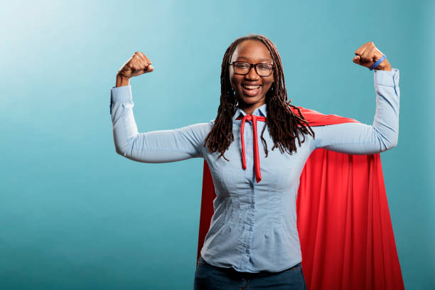 istock Happy positive justice defender flexing arms as a sign of strength while standing on blue background. 1434974357