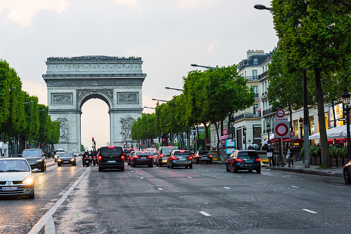 PARIS, FRANCE - MAY 8, 2017: Champs-Elysees and Arc de Triomphe. The Arc de Triomphe is one of the most famous monuments in Paris, standing at the western end of the Champs-Elysees. Paris, France.