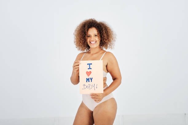 happy mixed race woman promoting self love - panties underwear transparent women imagens e fotografias de stock