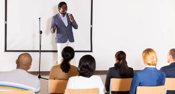 istock Male coach giving speech at conference hall 1434977132