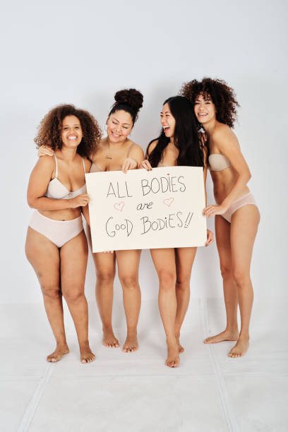 istock Diverse girlfriends with motivational poster laughing at joke 1434977854
