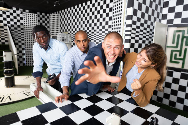 istock Four friends solving puzzles in quest room 1434978967