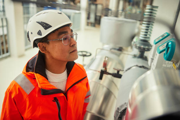 istock Young engineer inspecting a gauge in a power station 1434979695