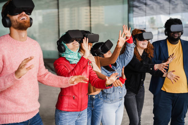 istock Young diverse people wearing virtual glasses outdoor - Metaverse concept 1434981566