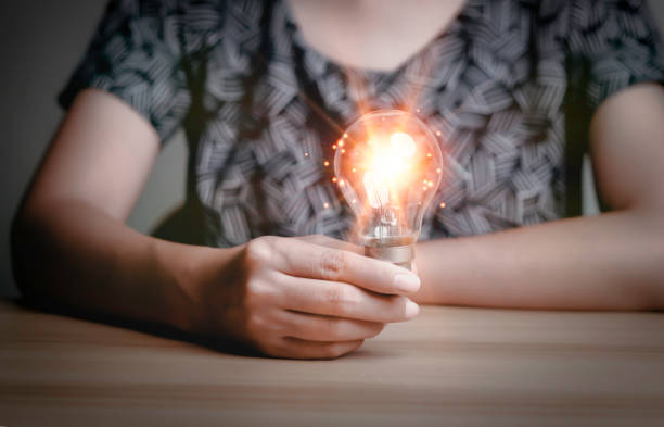 istock Businesswoman holding a light bulb, Creative new idea. Innovation, brainstorming, solution and inspiration concepts. imagination, creative thinking problem solving. 1434985114