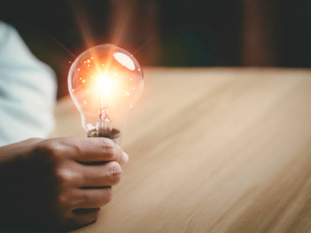istock Businesswoman holding a light bulb, Creative new idea. Innovation, brainstorming, solution and inspiration concepts. imagination, creative thinking problem solving. 1434985116