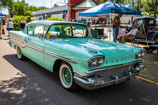 Falcon Heights, MN - June 19, 2022: High perspective front corner view of a 1958 Pontiac Chieftain 2 Door Hardtop at a local car show.