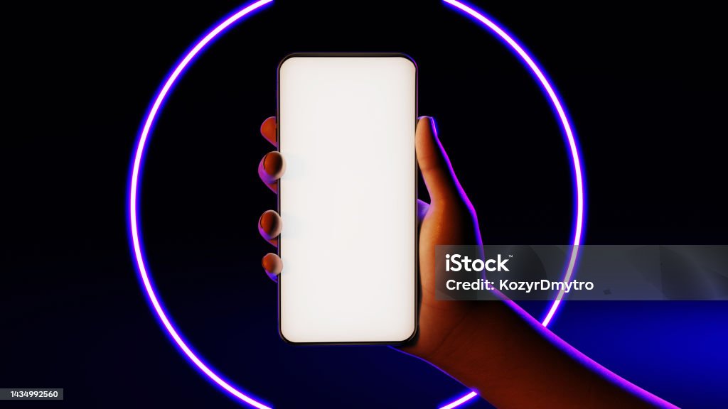 Phone in hand. Silhouette of male hand lit with blue neon lights holding bezel-less smartphone on black neon circle background. Screen is cut with clipping path Black Background Stock Photo