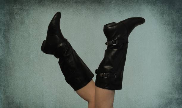 istock A woman doing her exercises wearing only knee-high leather boots 1434992957
