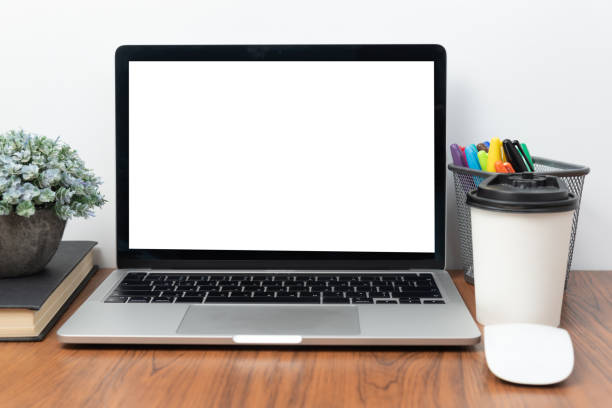 istock Computer laptop and coffee cup mouse on desk.Flat lay with blank copy space. 1434994985