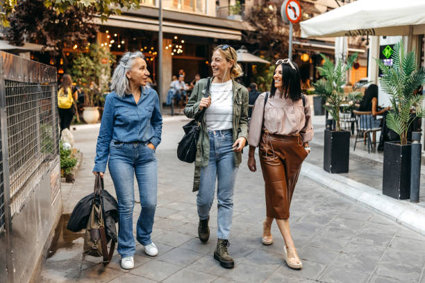 Female friends exploring city together stock photo