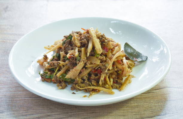 istock spicy stir fried bamboo shoot and chop beef meat with basil leaf 1434999894