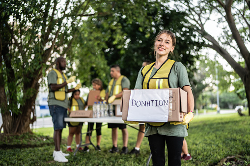 Portrait of a volunteer young woman at a public park