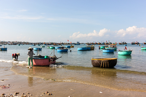 Mui Ne, Vietnam - April 2016: Fishing baskets floating in the waters off the coast off the fishing village in Mui Ne in South Vietnam.