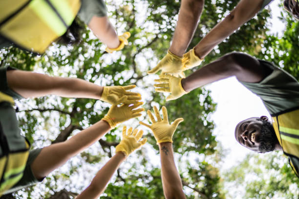 istock Peoples with arms raised outdoors 1435004433