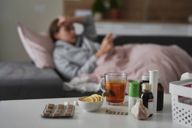 Table full of medicines for cold and flu stock photo