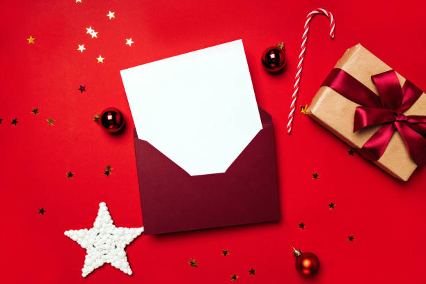 istock Envelope with letter and gift on a red background 1435008690