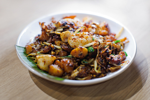 Fried Carrot Cake With Prawns And Squids, Popular Street Food In Penang, Malaysia