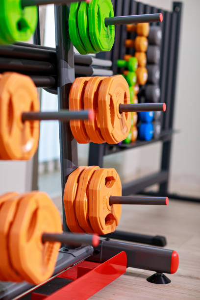 istock stand for barbell discs and dumbbells for the gym. 1435017641