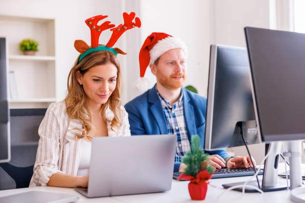 istock Business colleagues working at the office for Christmas 1435018961