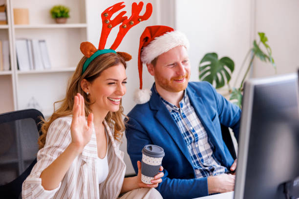 istock Business people having conference call while working at the office during Christmas 1435019289