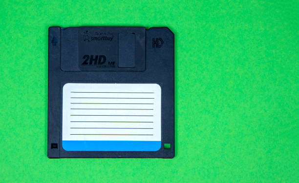 istock obsolete computer floppy disks on a colored background, isolated, 1435019304