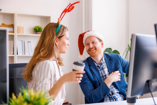 istock Business team celebrating Christmas at the office, taking coffee break 1435020186