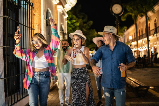 istock Friends having fun on the city at night 1435022119