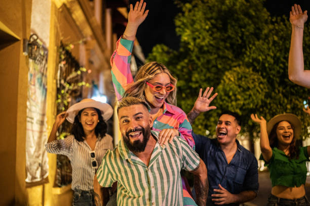 istock Couple playing piggyback on the steet at night 1435024648